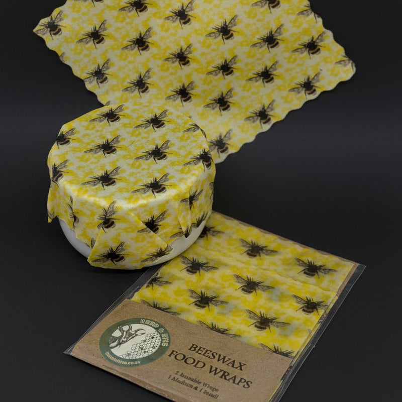 Beeswax food wraps with bee pattern on a white background